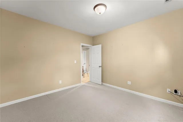 an aerial view of a house with a yard basket ball court