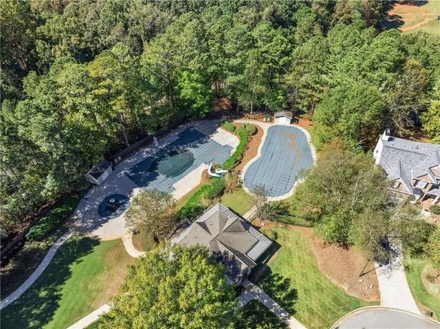 a view of swimming pool with a patio