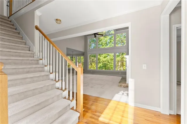 a view of an empty room with stairs