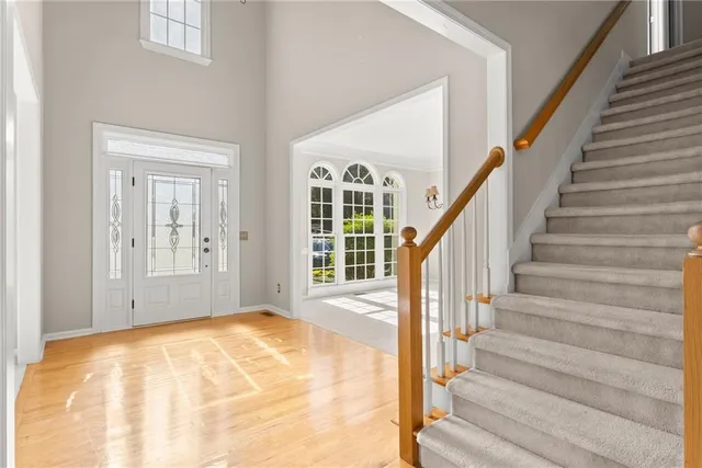 a view of a room with windows and chandelier