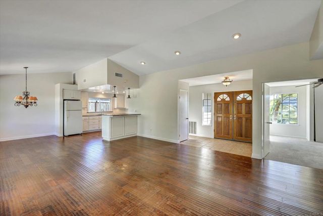 a view of a kitchen with a sink and a stove top oven