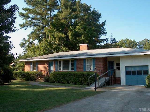 3317 Old Buffaloe Road Raleigh, NC 27604 - Photo 1 of 1 a front view of a house with a yard