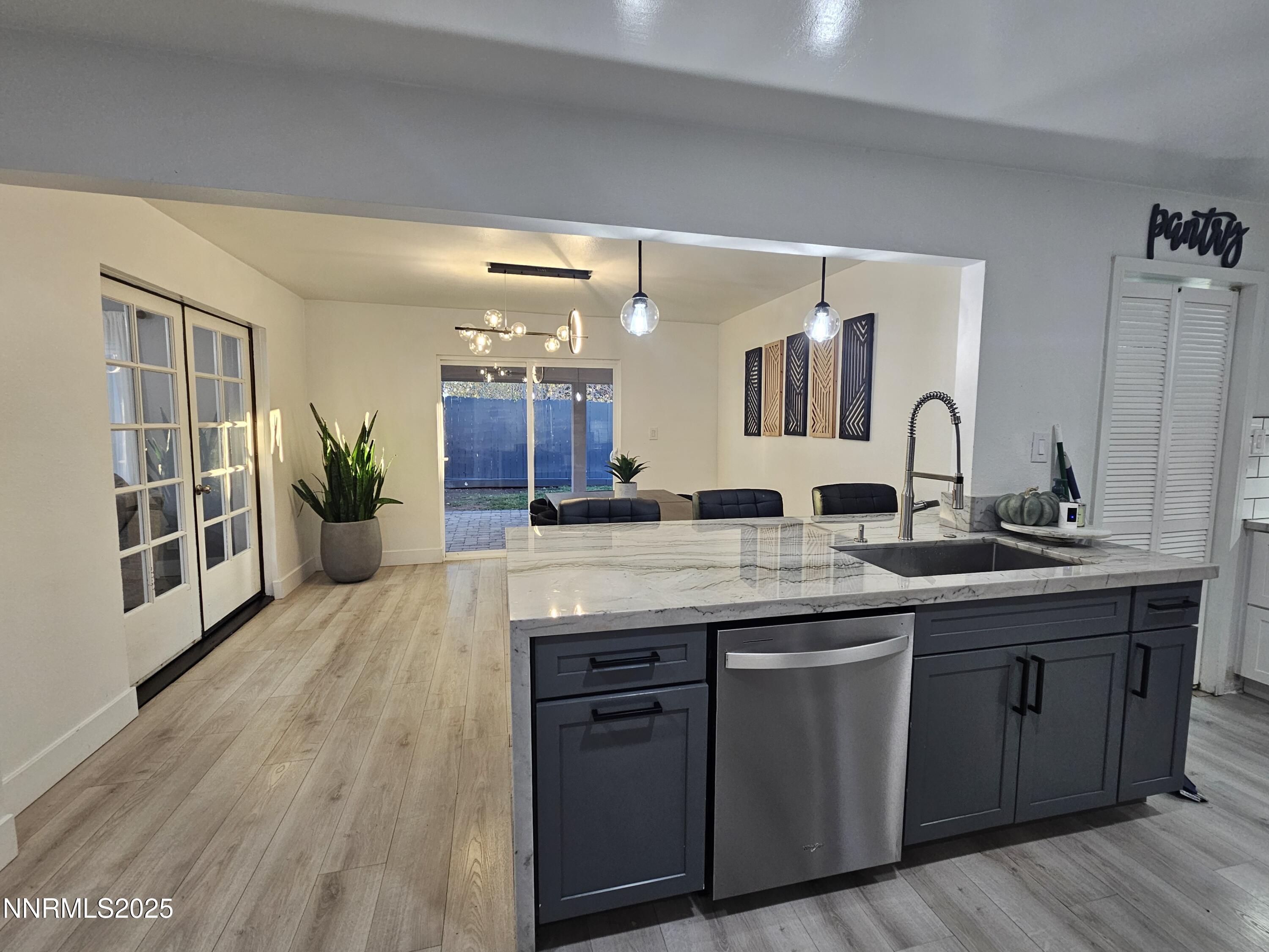 181 Quail Street Sparks, NV 89431 - Photo 11 of 42 a spacious bathroom with a granite countertop sink a toilet and a large mirror