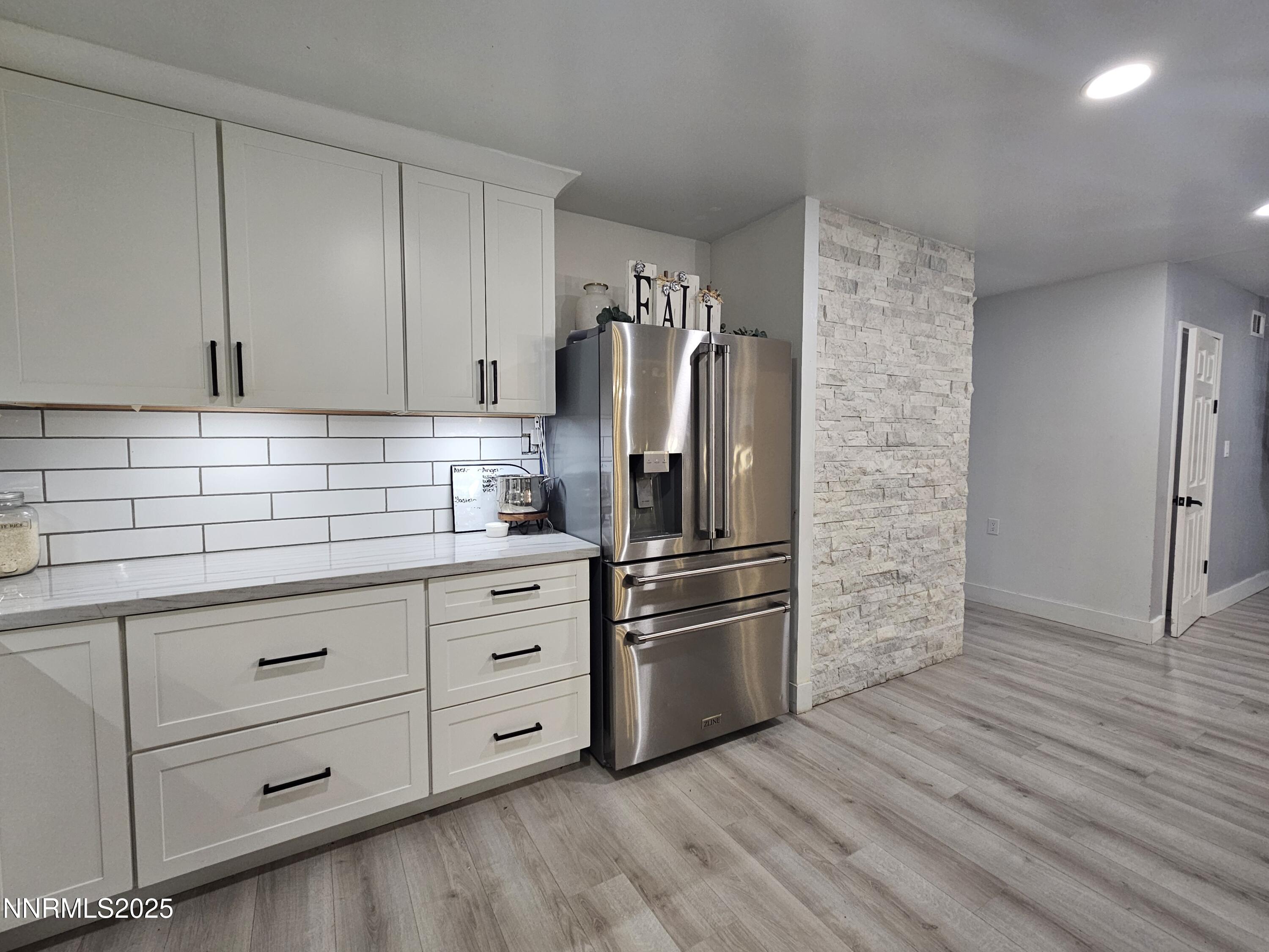 181 Quail Street Sparks, NV 89431 - Photo 12 of 42 a kitchen with appliances and cabinets