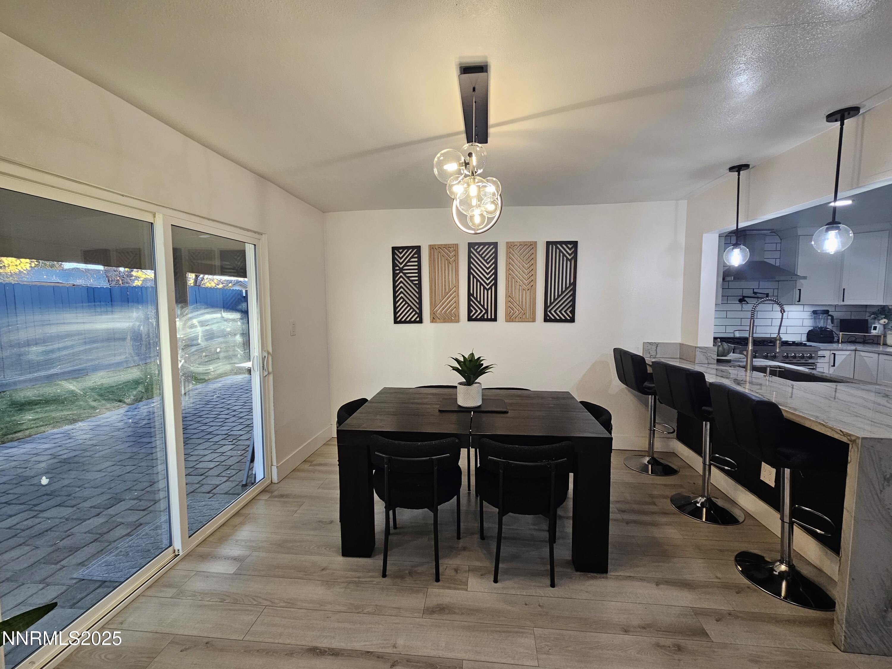 181 Quail Street Sparks, NV 89431 - Photo 17 of 42 a view of a dining room with a table and chairs