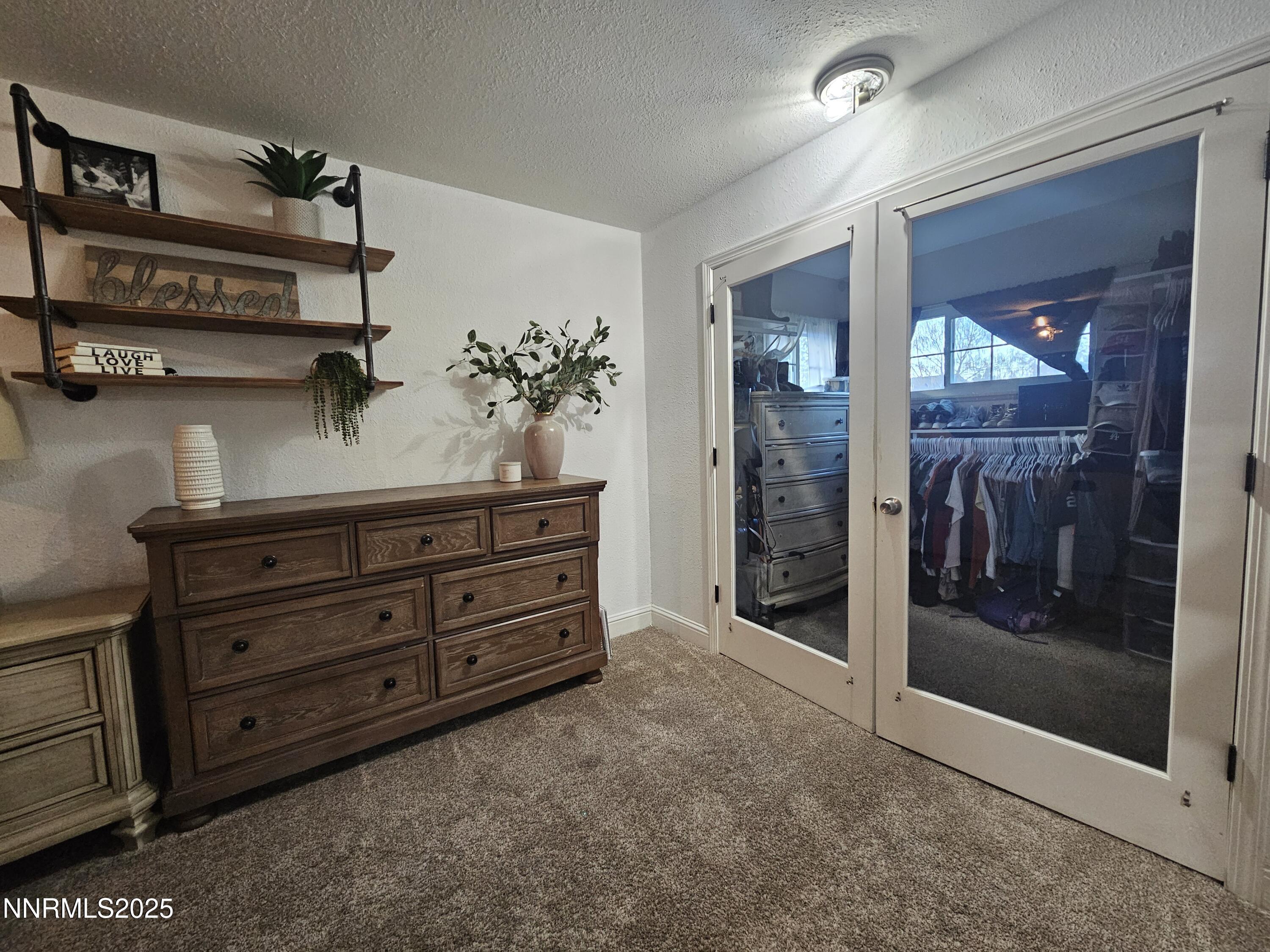 181 Quail Street Sparks, NV 89431 - Photo 31 of 42 a room with a baby crib and a dresser