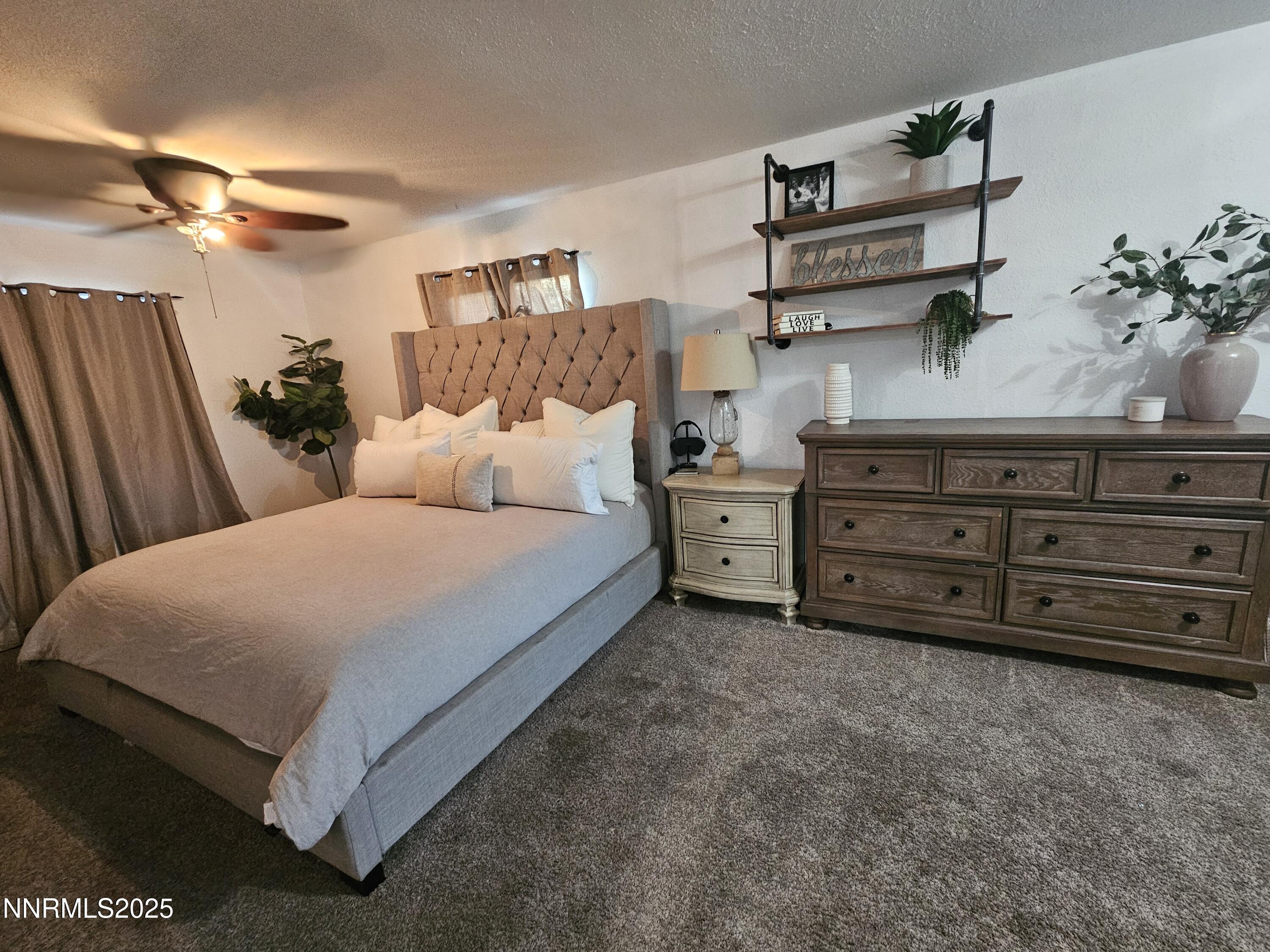 181 Quail Street Sparks, NV 89431 - Photo 32 of 42 a bedroom with a bed and a dresser