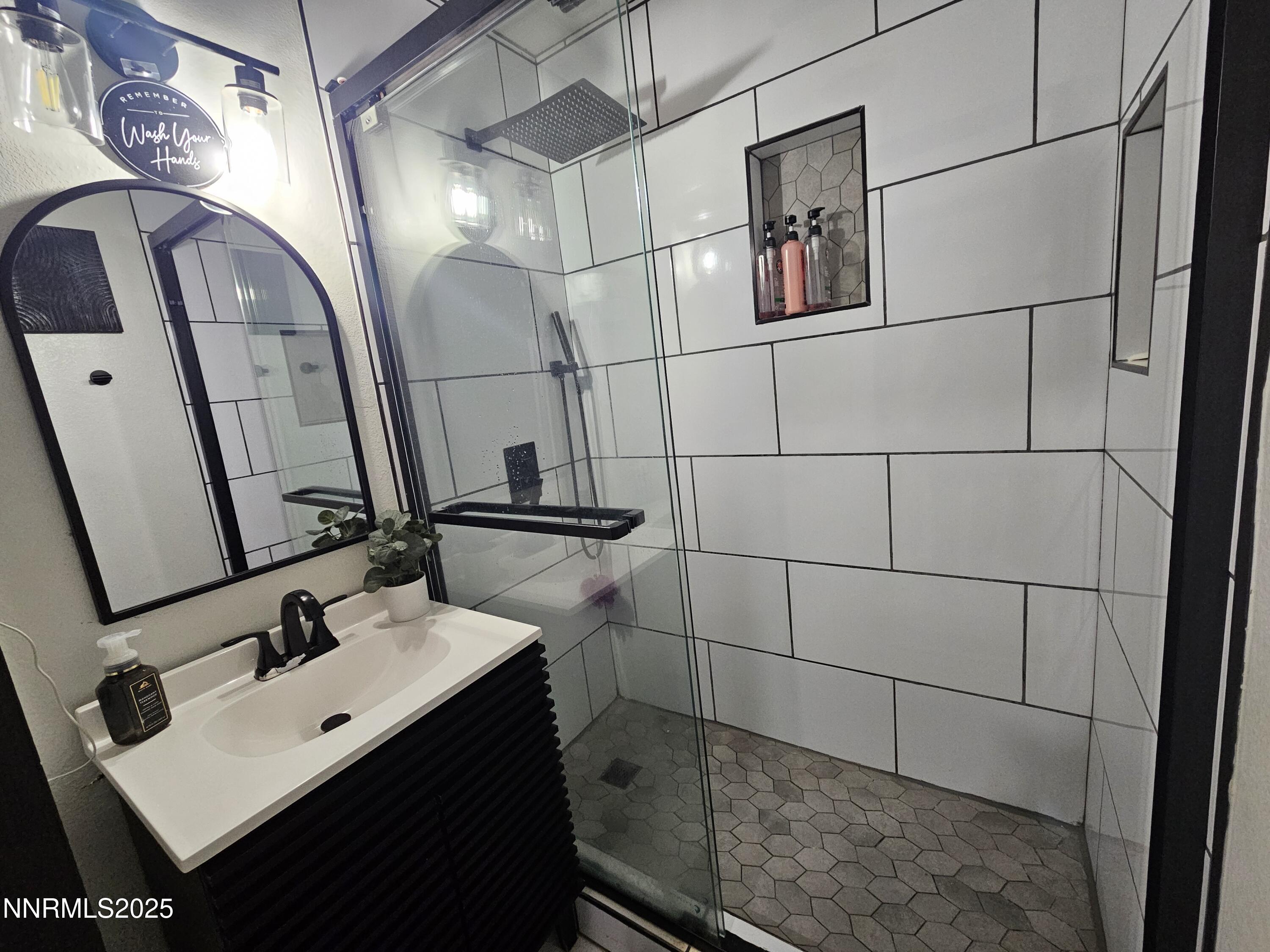 181 Quail Street Sparks, NV 89431 - Photo 36 of 42 a bathroom with a sink and mirror