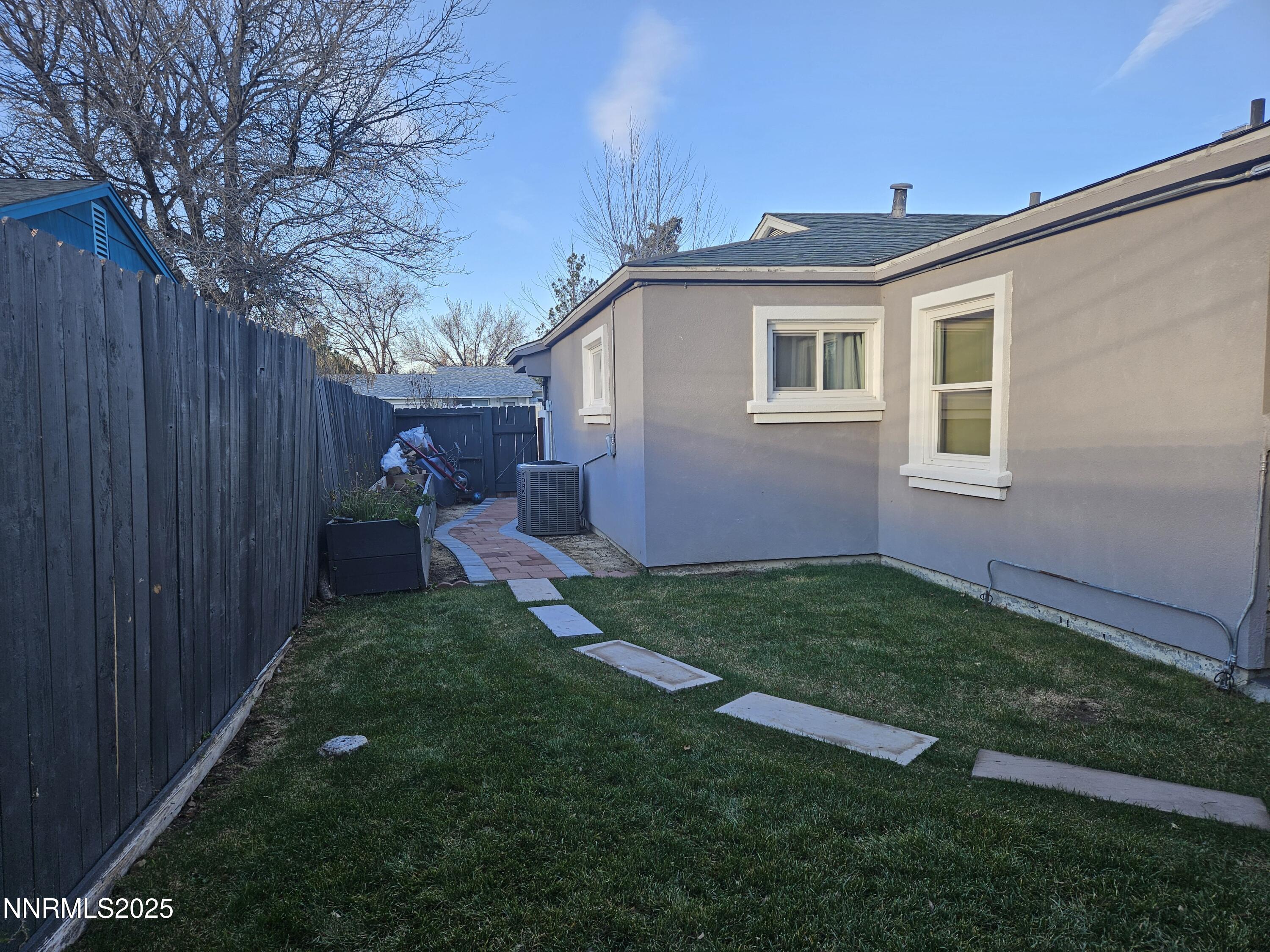 181 Quail Street Sparks, NV 89431 - Photo 38 of 42 a view of backyard of house with wooden fence