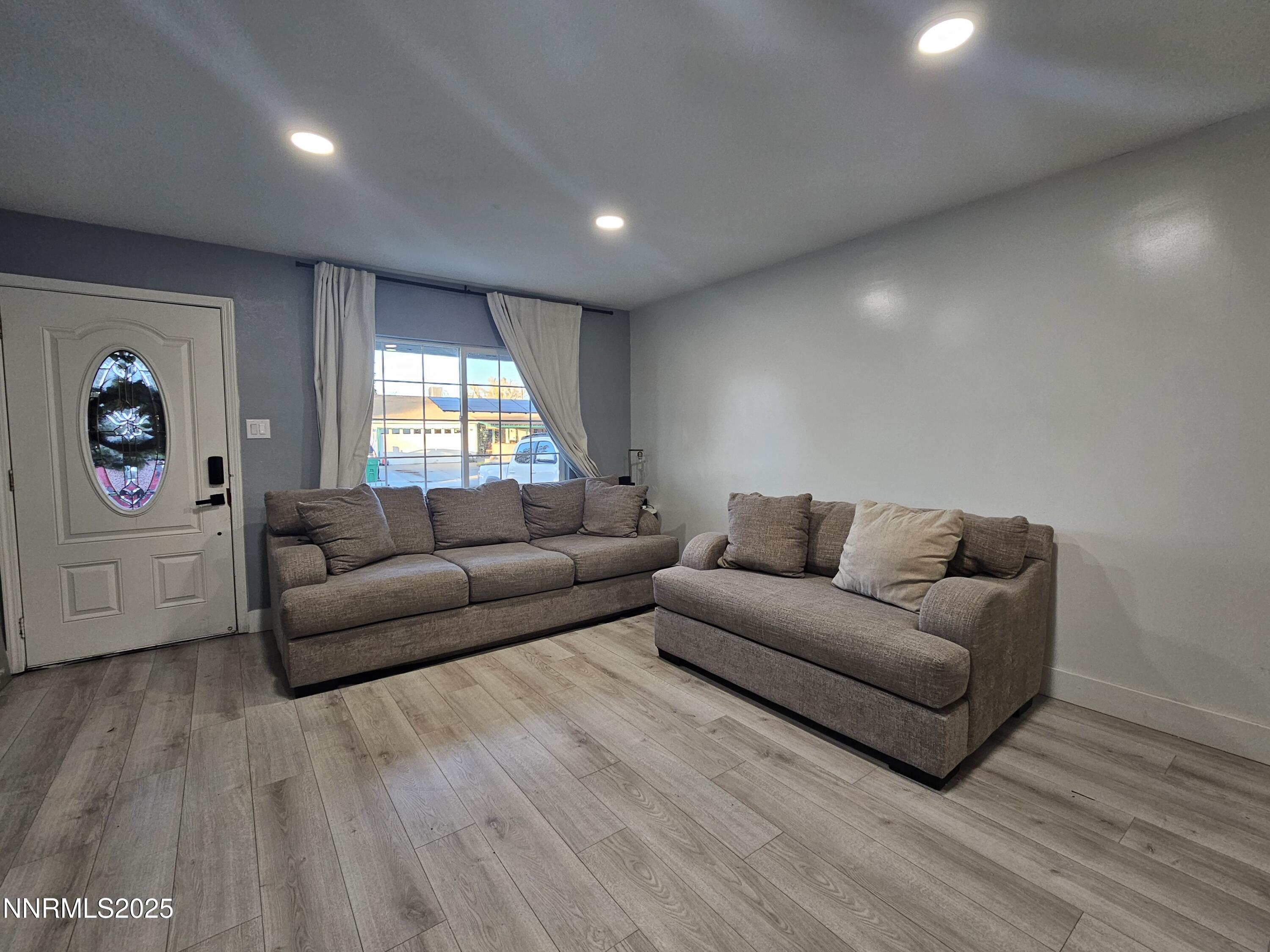 181 Quail Street Sparks, NV 89431 - Photo 5 of 42 a living room with furniture and a large window