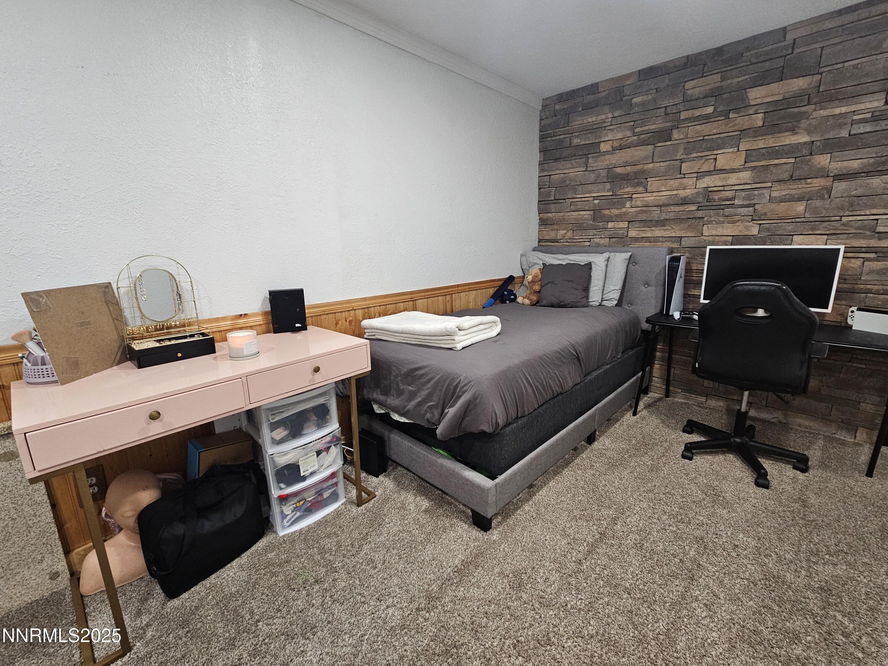 181 Quail Street Sparks, NV 89431 - Photo 7 of 42 a bed room with a bed and a chair