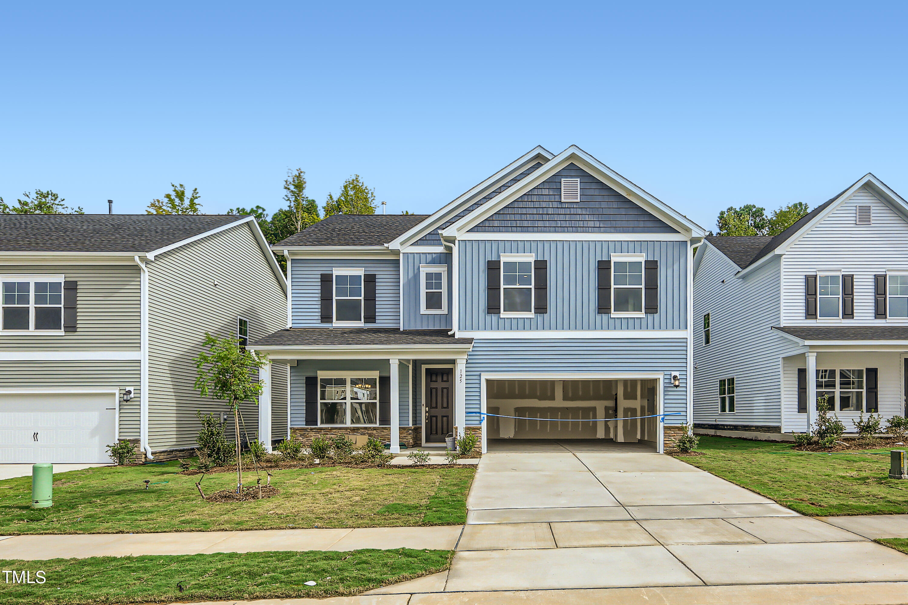 132 Eden View Bend, Unit 673 Raleigh, NC 27610 - Photo 1 of 19 a front view of a house with a yard