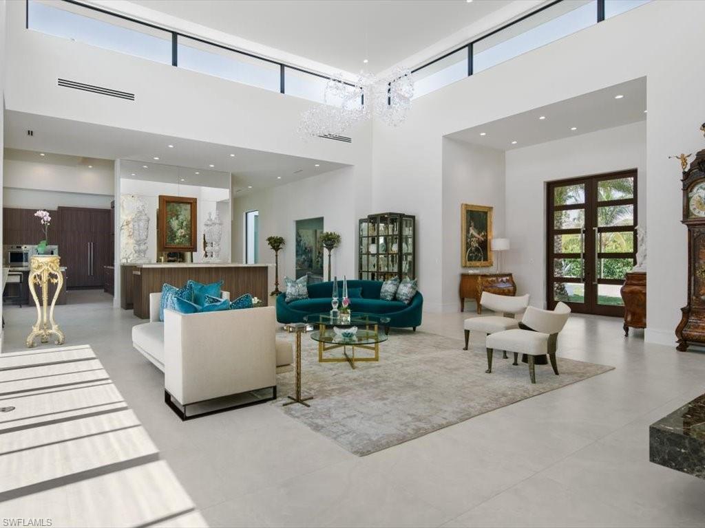172 Center Street Naples, FL 34108 - Photo 12 of 50 a living room with furniture and wooden floor
