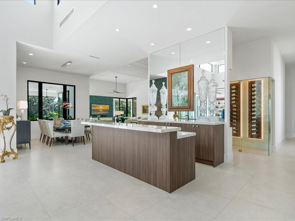 172 Center Street Naples, FL 34108 - Photo 15 of 50 a kitchen with kitchen island granite countertop lots of counter top space