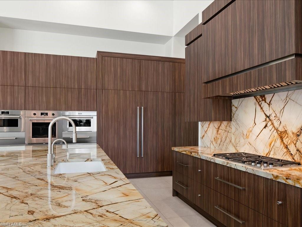 172 Center Street Naples, FL 34108 - Photo 17 of 50 a view of a patio with table and chairs