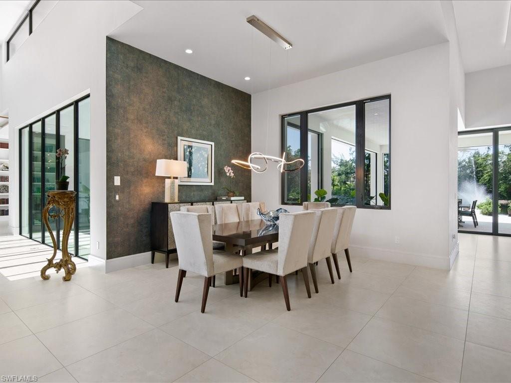 172 Center Street Naples, FL 34108 - Photo 18 of 50 a dining room with furniture and large windows