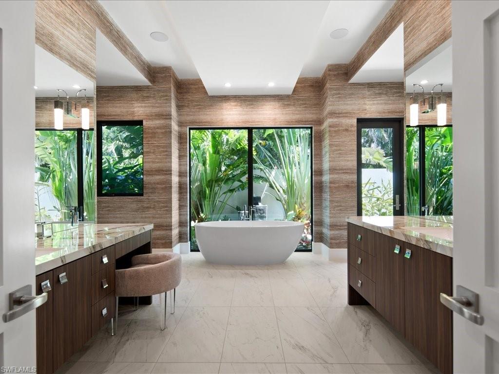 172 Center Street Naples, FL 34108 - Photo 25 of 50 a large window with swimming pool in front of it