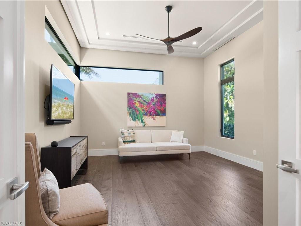 172 Center Street Naples, FL 34108 - Photo 32 of 50 a living room with furniture and a flat screen tv