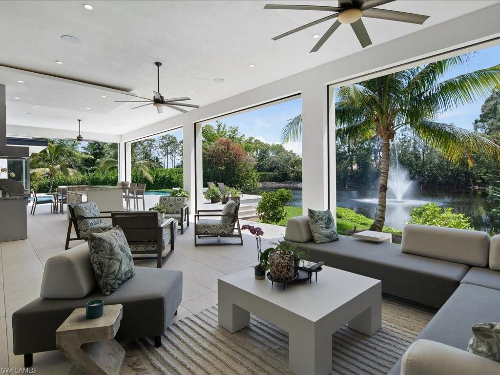 172 Center Street Naples, FL 34108 - Photo 37 of 50 a living room with furniture and a large window