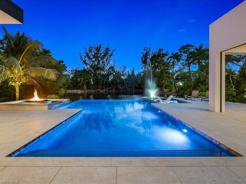 172 Center Street Naples, FL 34108 - Photo 4 of 50 a view of swimming pool with outdoor seating