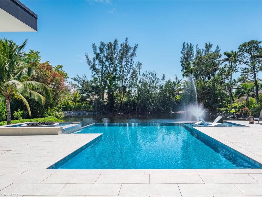 172 Center Street Naples, FL 34108 - Photo 42 of 50 a view of swimming pool with a yard