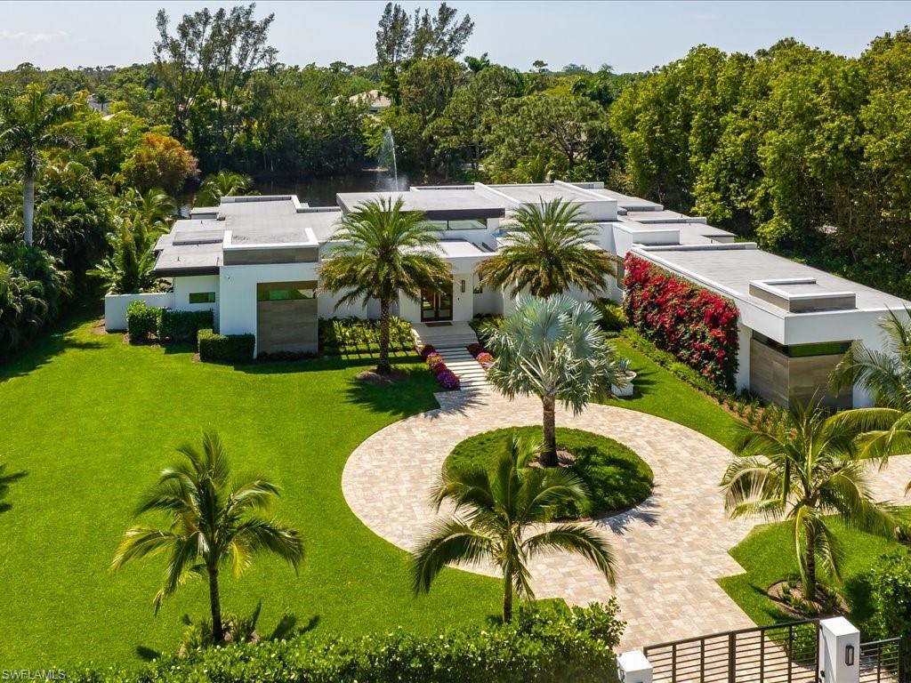 172 Center Street Naples, FL 34108 - Photo 49 of 50 a view of a swimming pool with a yard