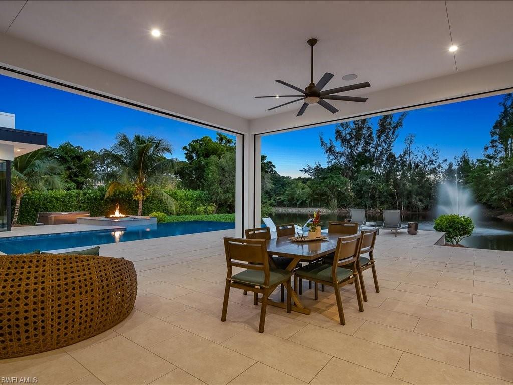 172 Center Street Naples, FL 34108 - Photo 5 of 50 a view of a patio with a table and chairs