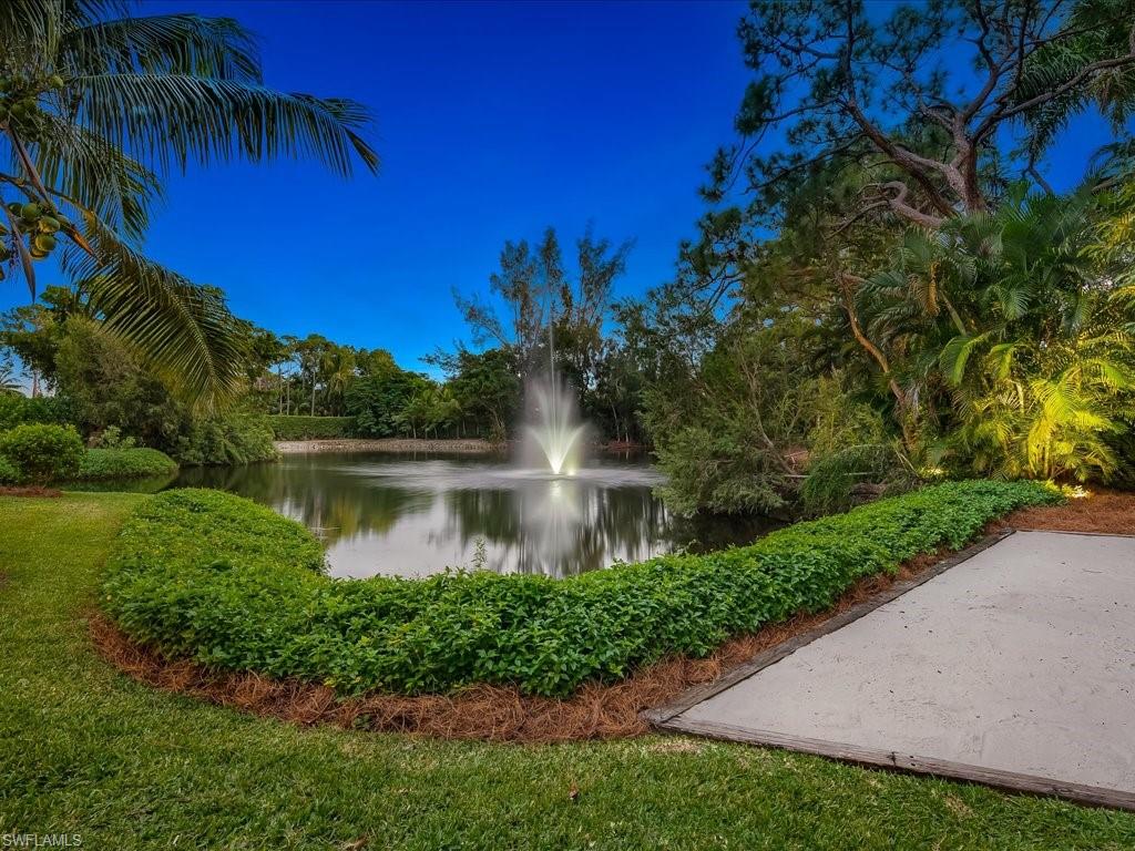 172 Center Street Naples, FL 34108 - Photo 6 of 50 a front view of a house with a yard