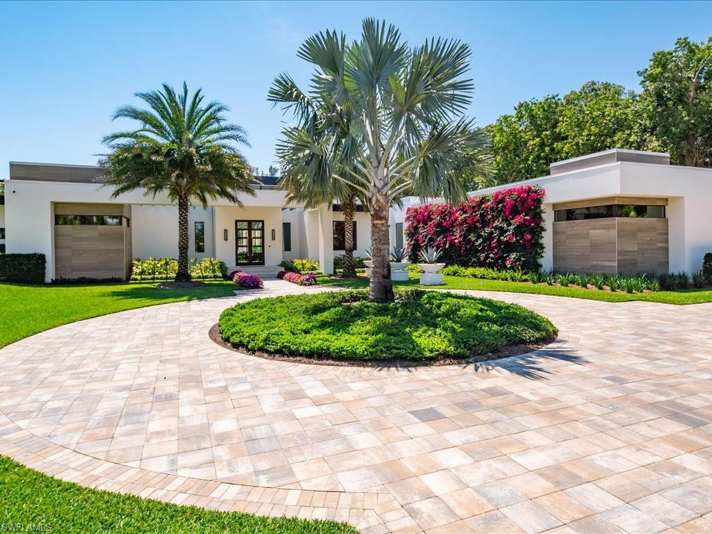 172 Center Street Naples, FL 34108 - Photo 8 of 50 a front view of house with yard and green space