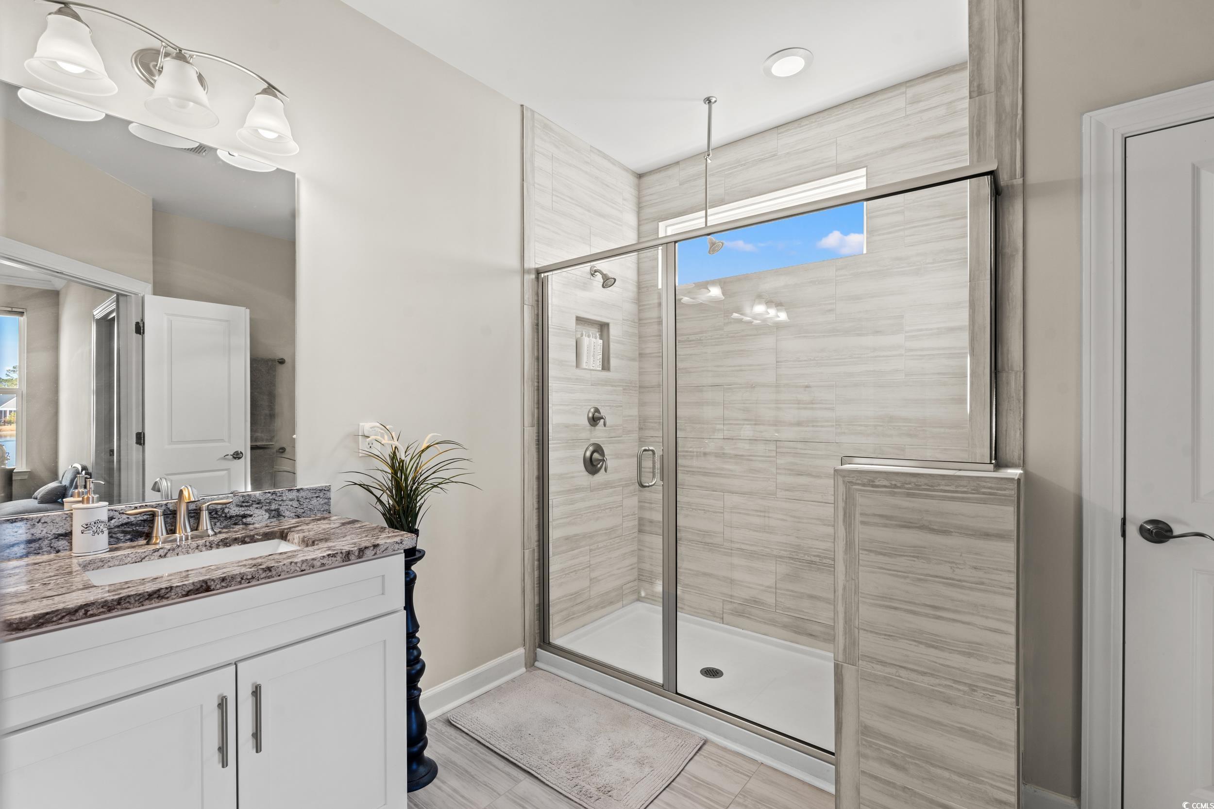 457 Cascade Loop Little River, SC 29566 - Photo 14 of 40 Bathroom with hardwood / wood-style flooring, vani