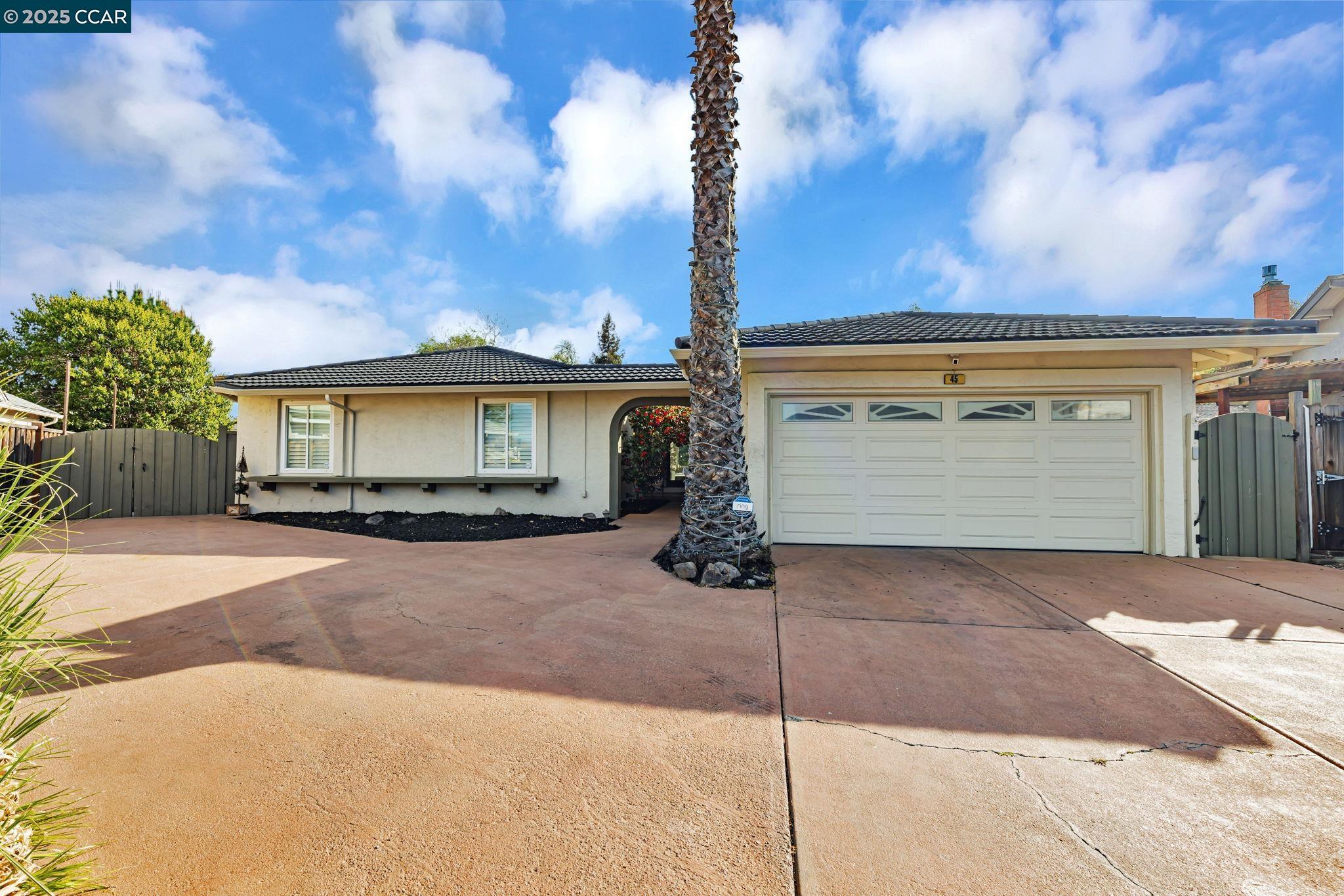 45 Tareyton Court San Ramon, CA 94583 - Photo 1 of 1 a view of a house with a yard and garage