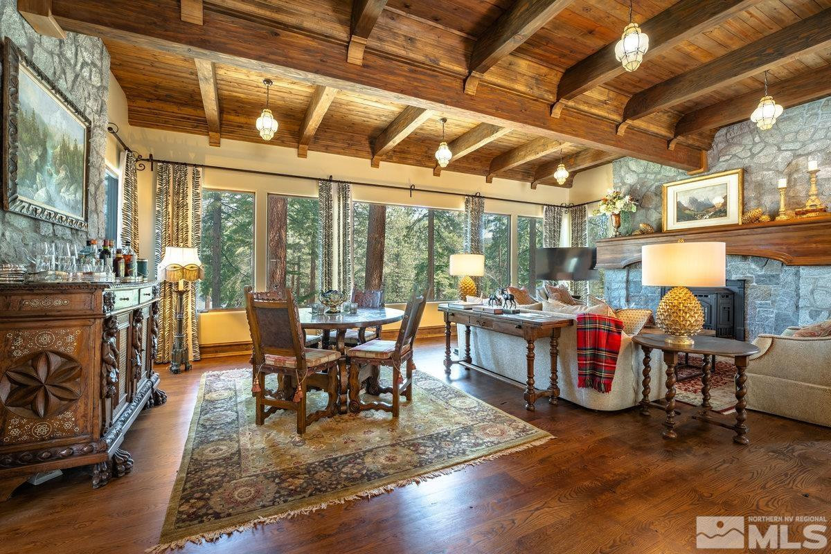 190 Yellow Jacket Road Glenbrook, NV 89413 - Photo 13 of 42 a dining room with furniture a fireplace and wooden floor