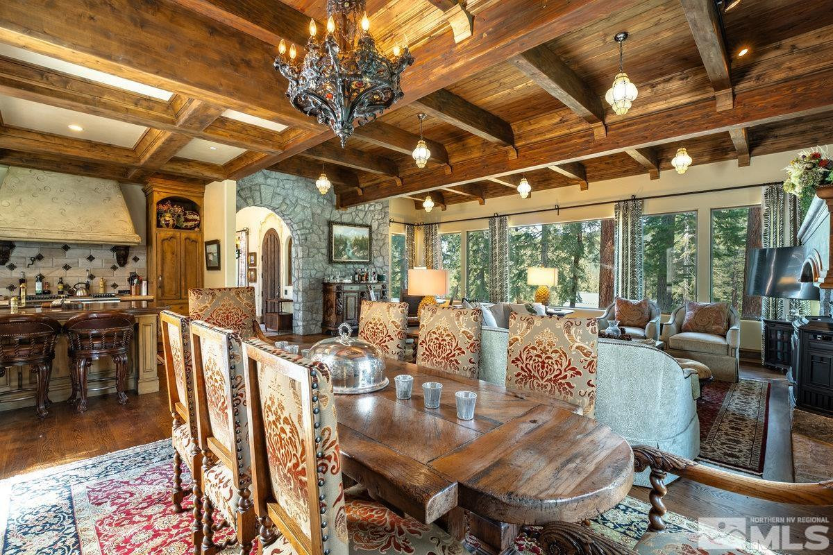190 Yellow Jacket Road Glenbrook, NV 89413 - Photo 14 of 42 a view of a dining room with furniture a chandelier and wooden floor