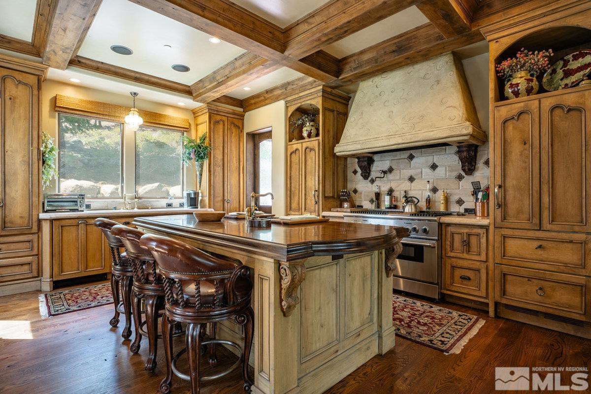 190 Yellow Jacket Road Glenbrook, NV 89413 - Photo 16 of 42 a kitchen with stainless steel appliances granite countertop a stove and a refrigerator