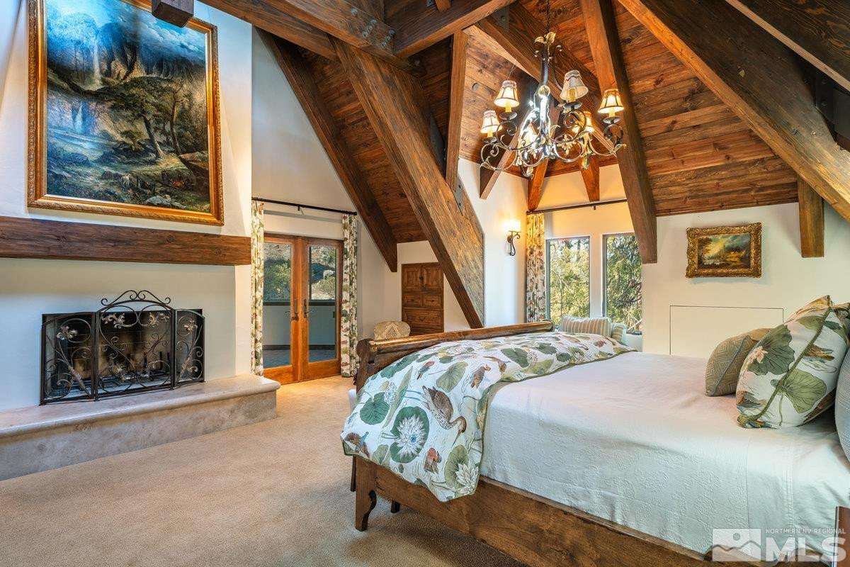 190 Yellow Jacket Road Glenbrook, NV 89413 - Photo 17 of 42 a bed sitting in a bedroom next to a window