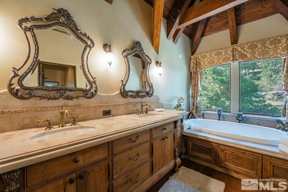 190 Yellow Jacket Road Glenbrook, NV 89413 - Photo 18 of 42 a spacious bathroom with a double vanity sink and a mirror