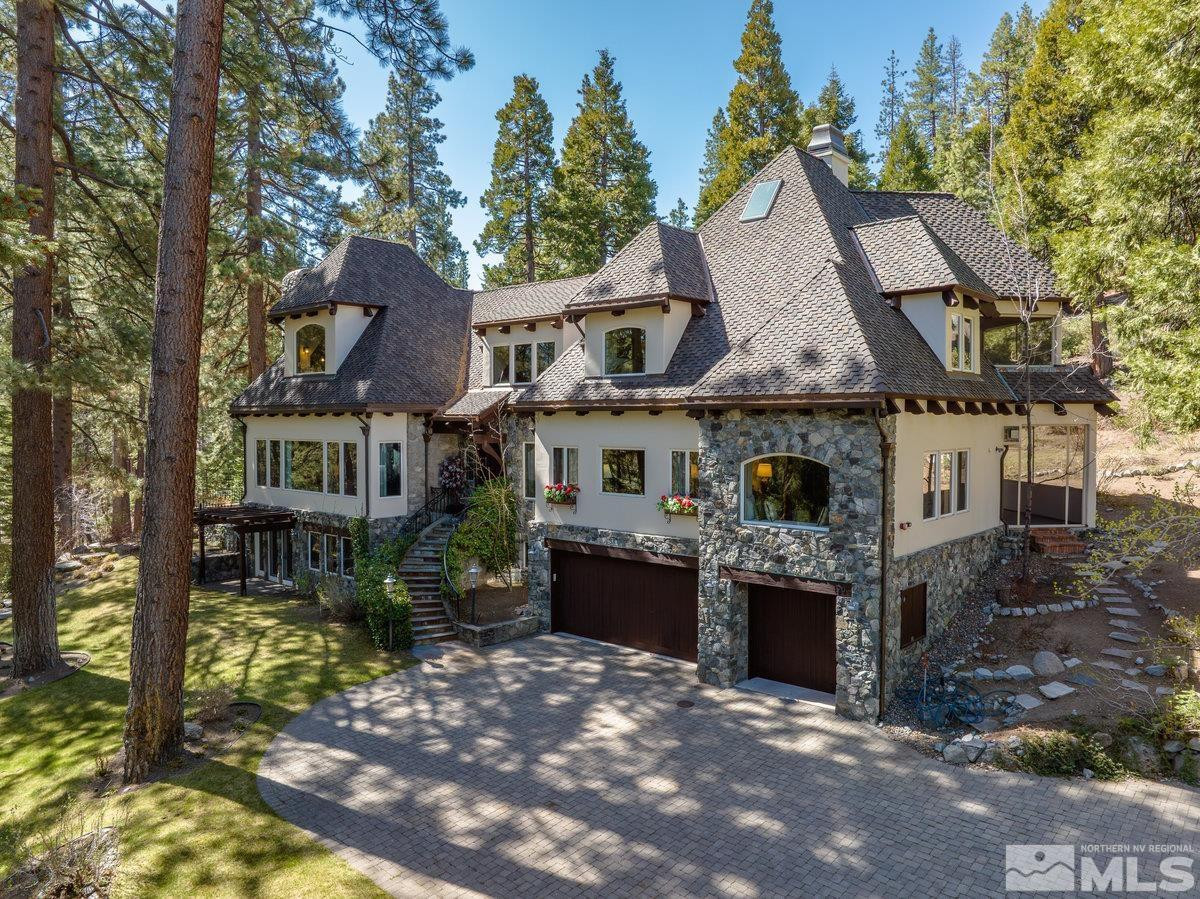 190 Yellow Jacket Road Glenbrook, NV 89413 - Photo 2 of 42 a front view of a house with a garden
