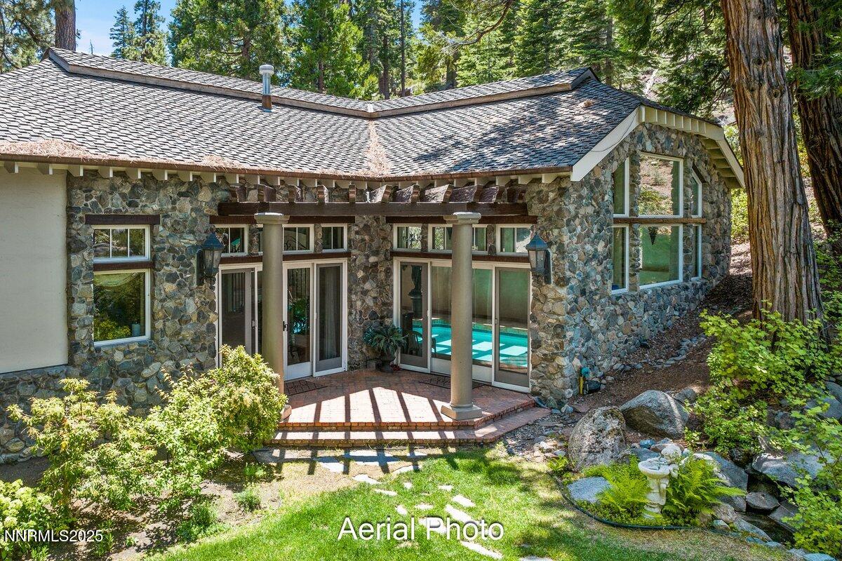 190 Yellow Jacket Road Glenbrook, NV 89413 - Photo 22 of 42 a front view of a house with garden