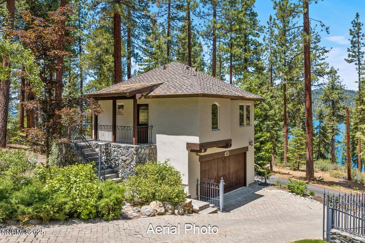 190 Yellow Jacket Road Glenbrook, NV 89413 - Photo 28 of 42 a front view of a house with garden