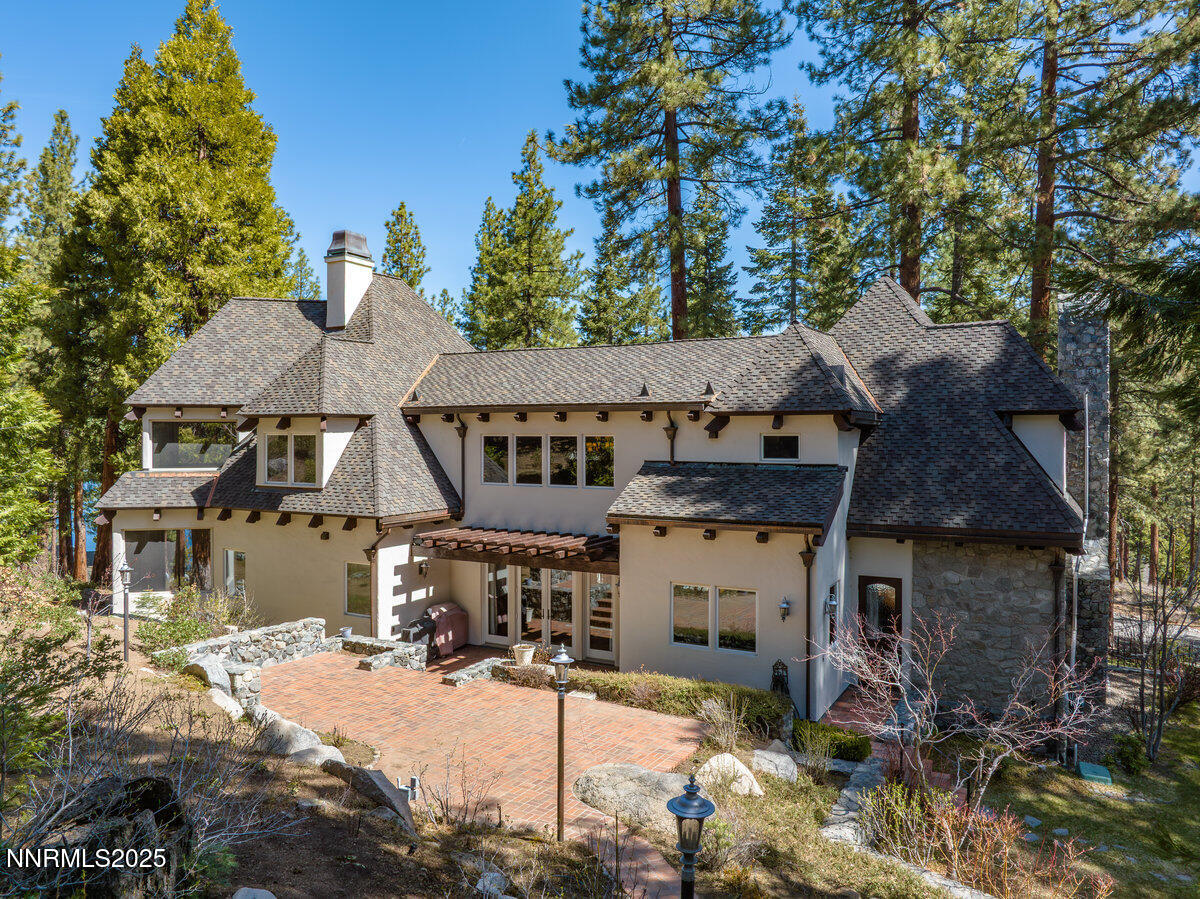 190 Yellow Jacket Road Glenbrook, NV 89413 - Photo 3 of 42 a front view of a house with a yard