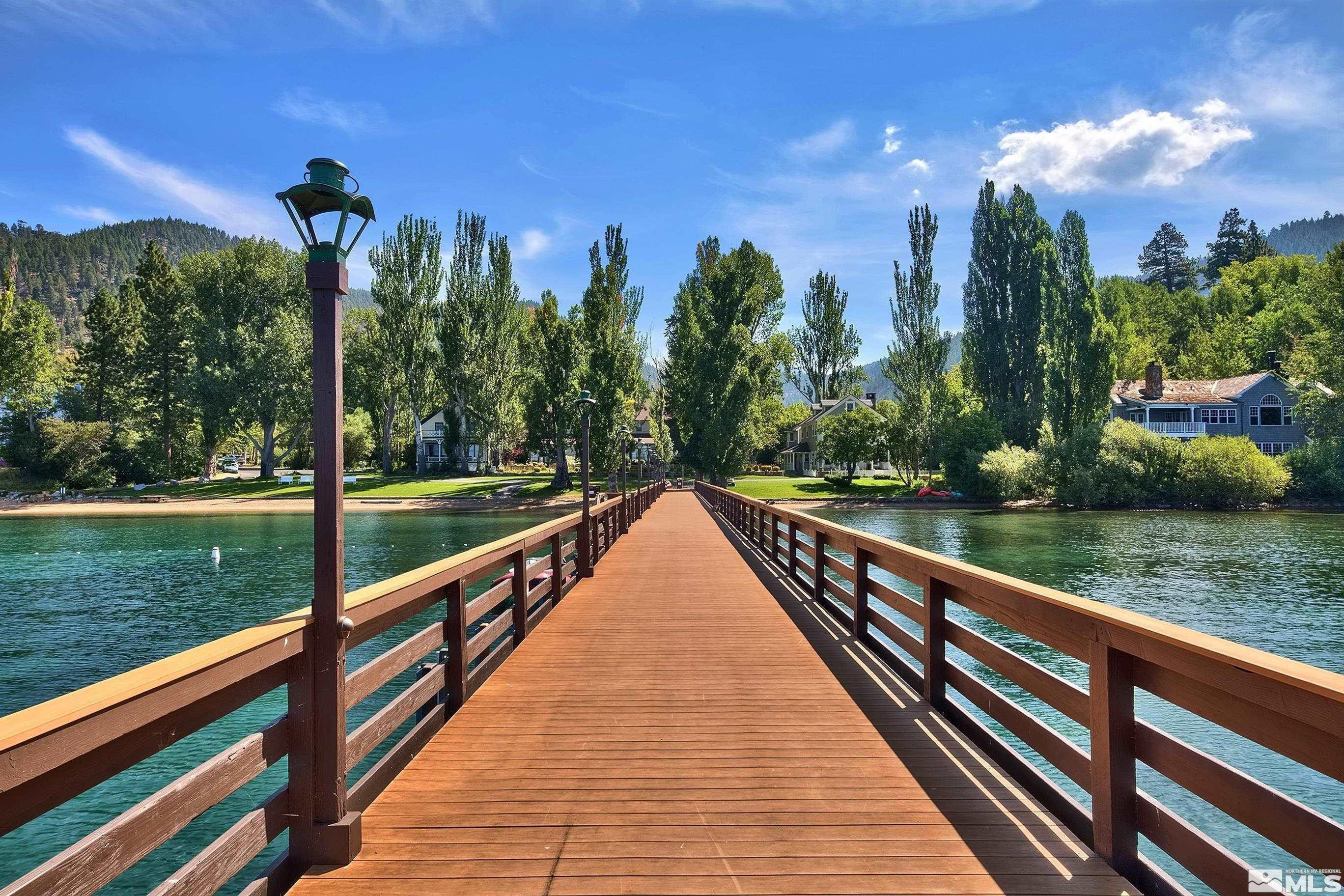 190 Yellow Jacket Road Glenbrook, NV 89413 - Photo 36 of 42 a view of a street with a yard and large trees in the background