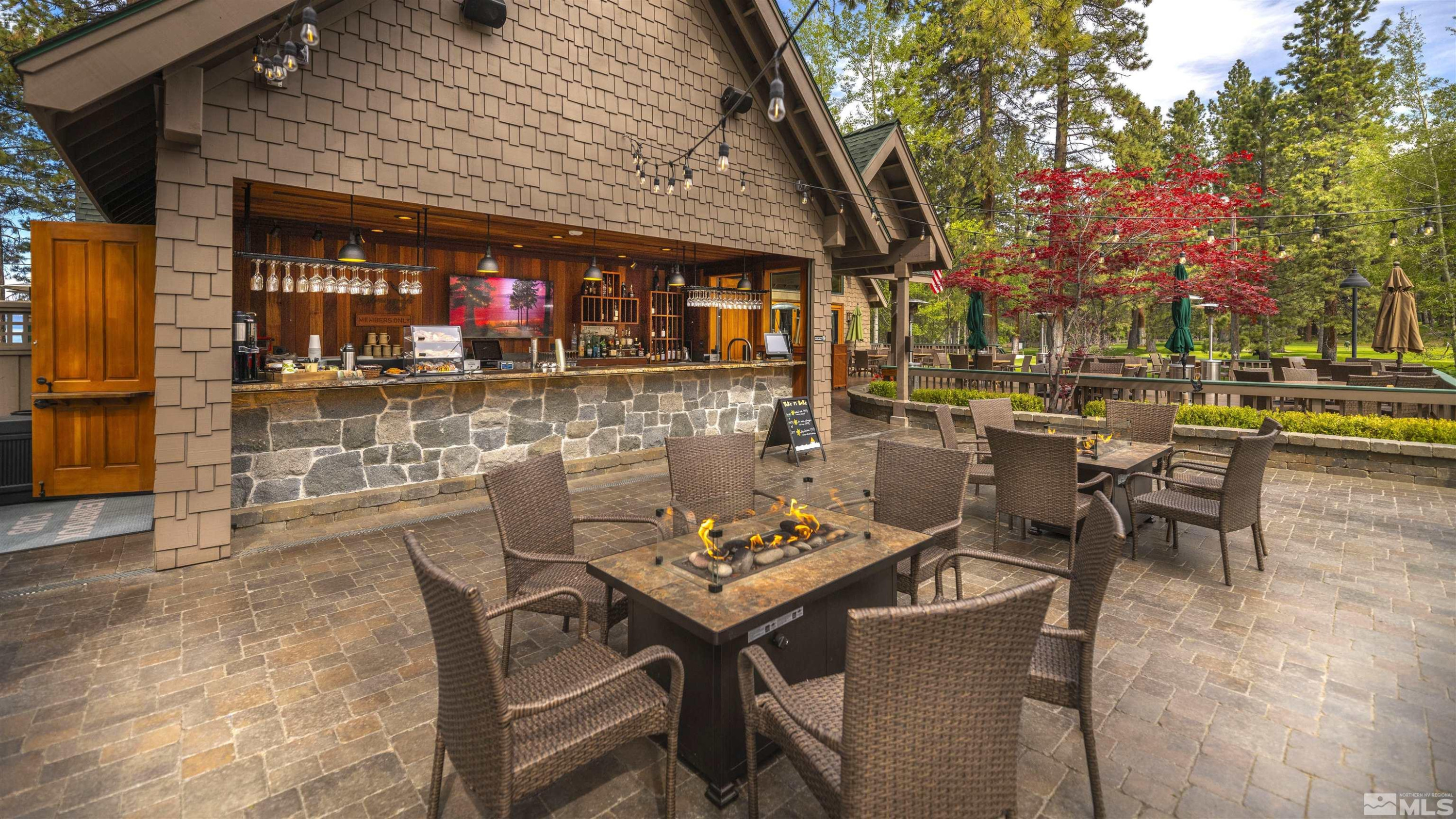 190 Yellow Jacket Road Glenbrook, NV 89413 - Photo 39 of 42 a view of a patio with table and chairs and potted plants