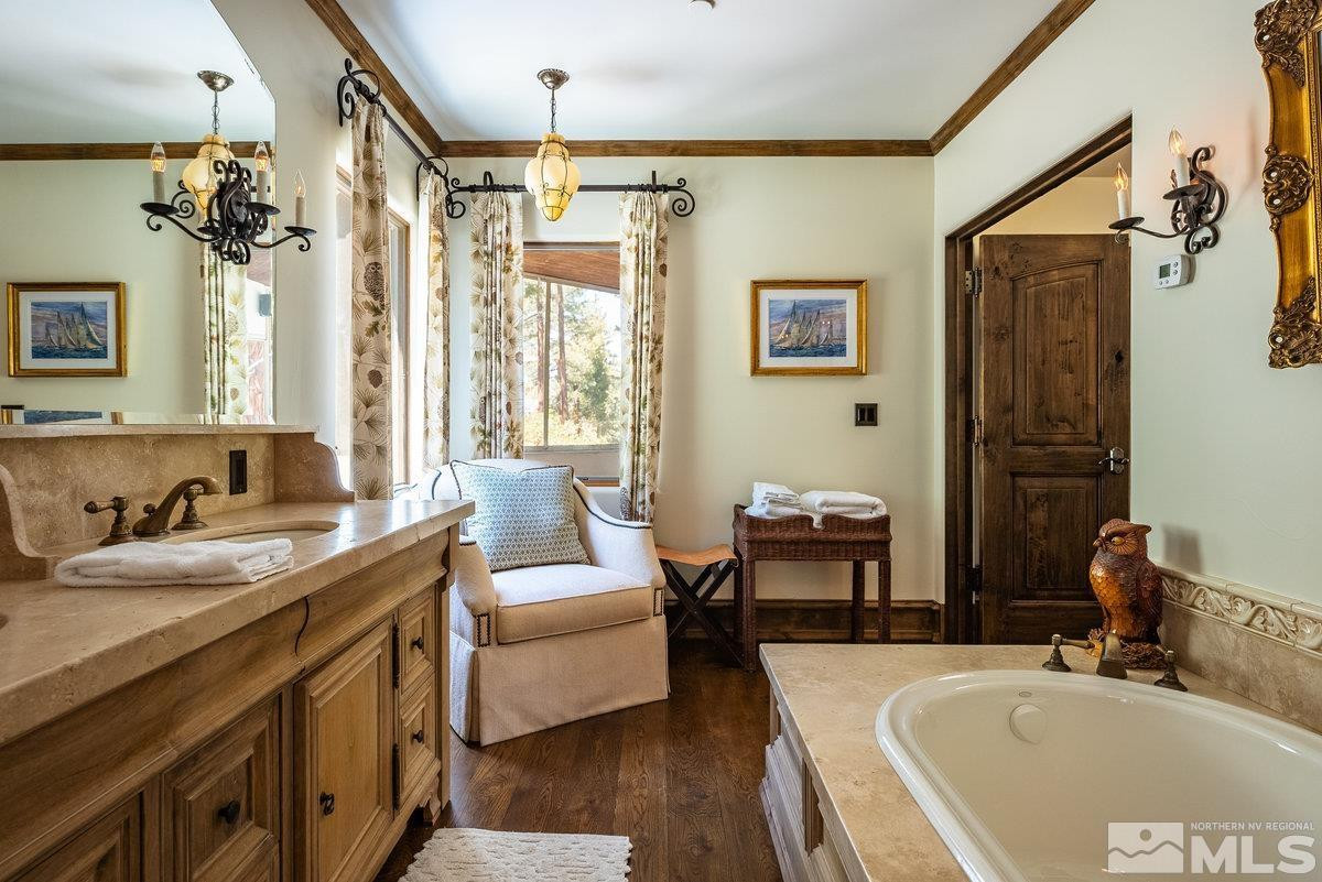 190 Yellow Jacket Road Glenbrook, NV 89413 - Photo 9 of 42 a bathroom with a tub sink and mirror