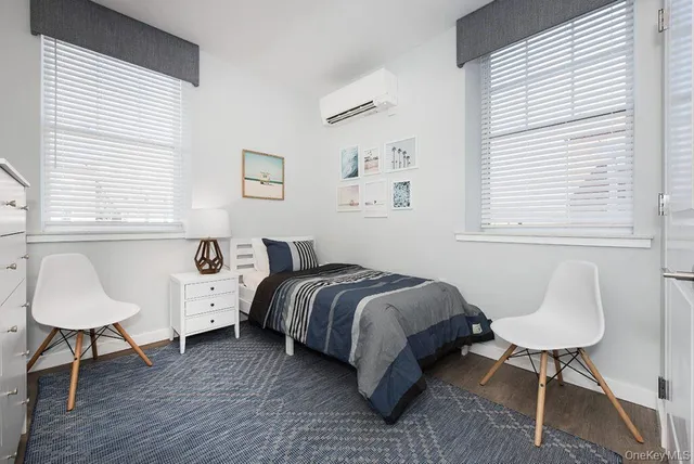 a bathroom with a toilet a sink and a mirror