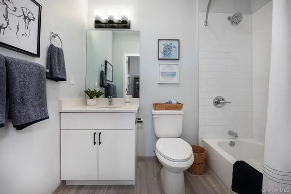 a bedroom with a bed and a chair