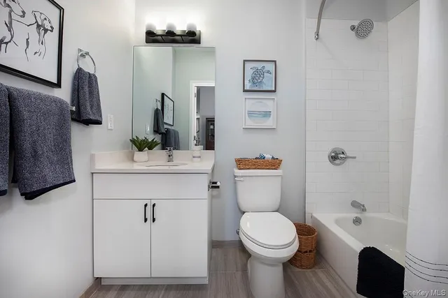 a bedroom with a bed and a chair