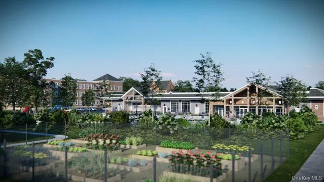 a front view of a house with a yard table and chairs