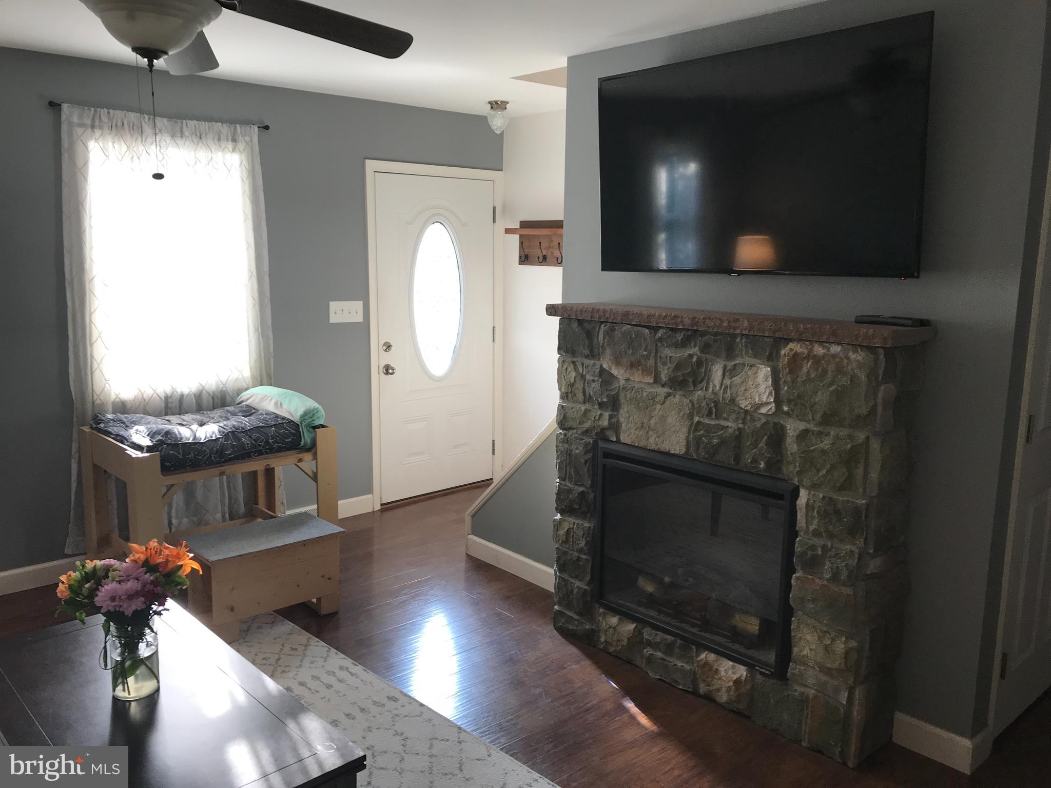 195 River Road Pequea, PA 17565 - Photo 12 of 77 a living room with furniture and a fireplace