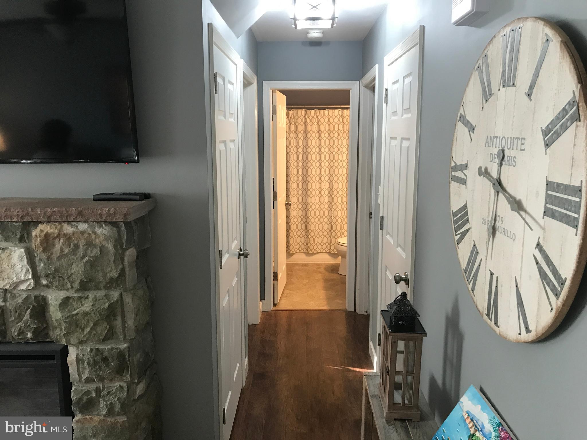 195 River Road Pequea, PA 17565 - Photo 21 of 77 a view of a livingroom with wooden floor and a flat screen tv
