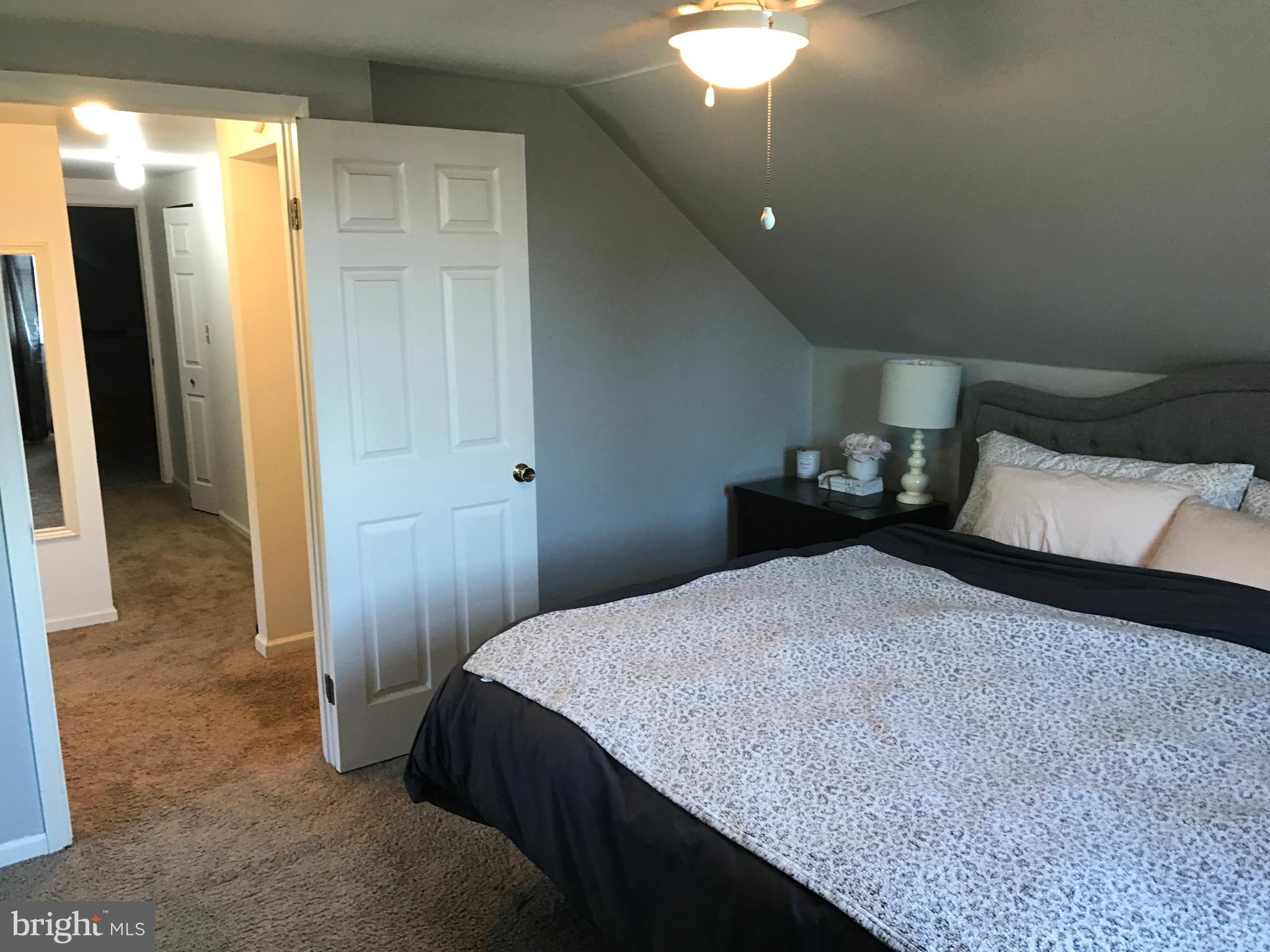 195 River Road Pequea, PA 17565 - Photo 41 of 77 a bedroom with a bed and a mirror